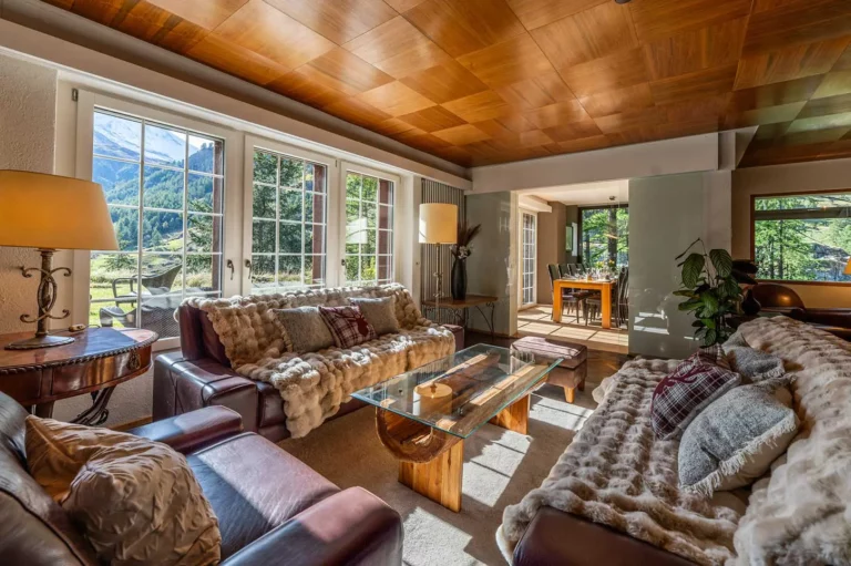 living room with arm chairs and sofas