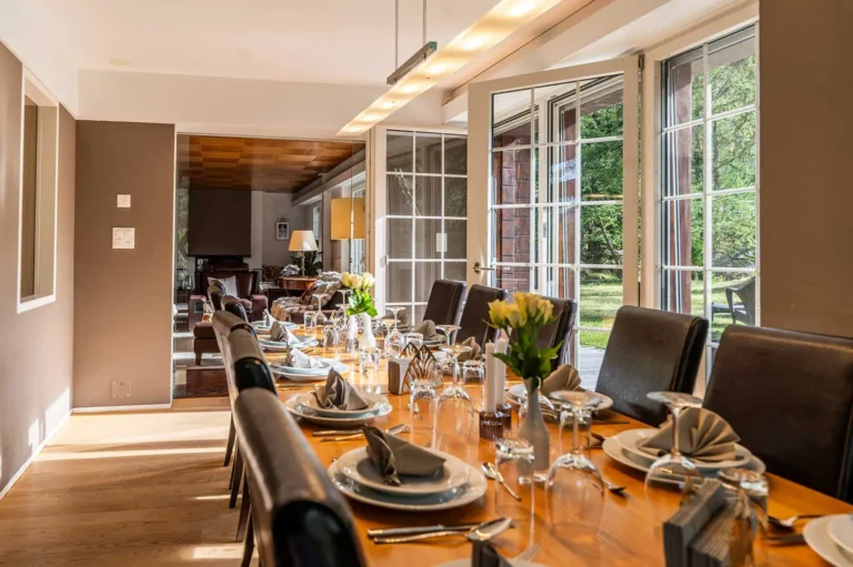 dining table with wine glasses and plattes