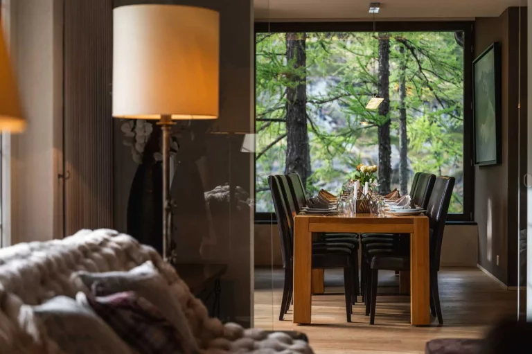 window with dining table and lamps in the living room