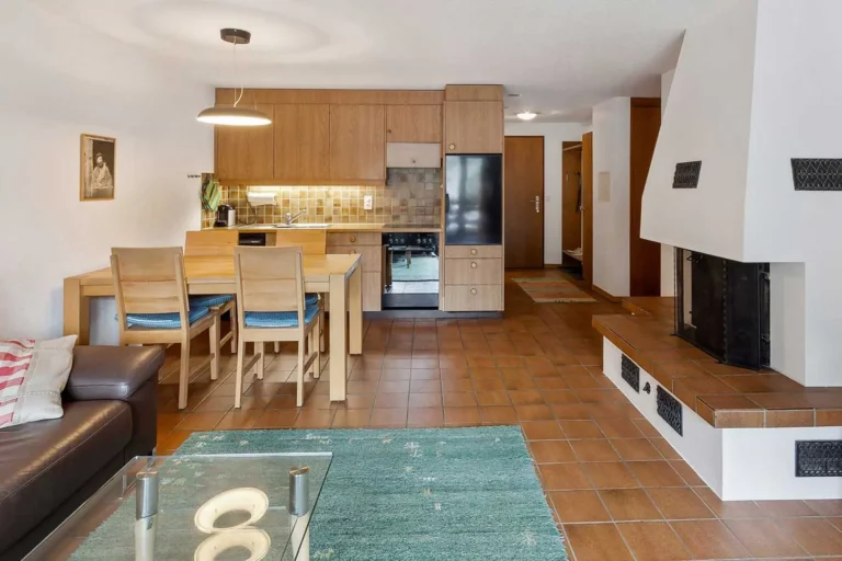 a kitchen and dining room with a fireplace